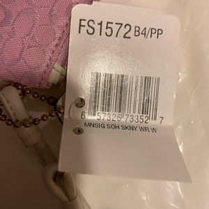 Coach pink and ivory wristlet. Never used, tag attached.